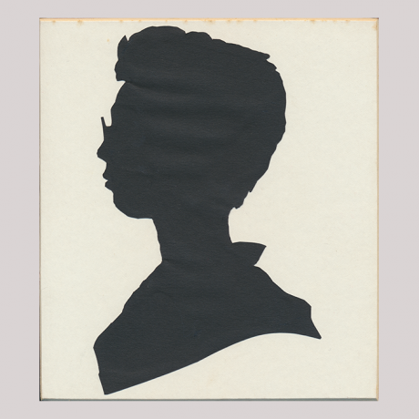 
        Front of silhouette, with man looking left, wearing glasses.